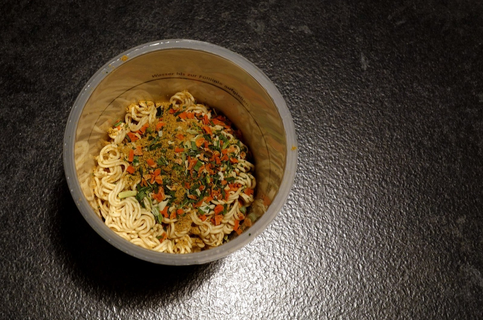 A cup of instant noodles, the kind she ended up living on