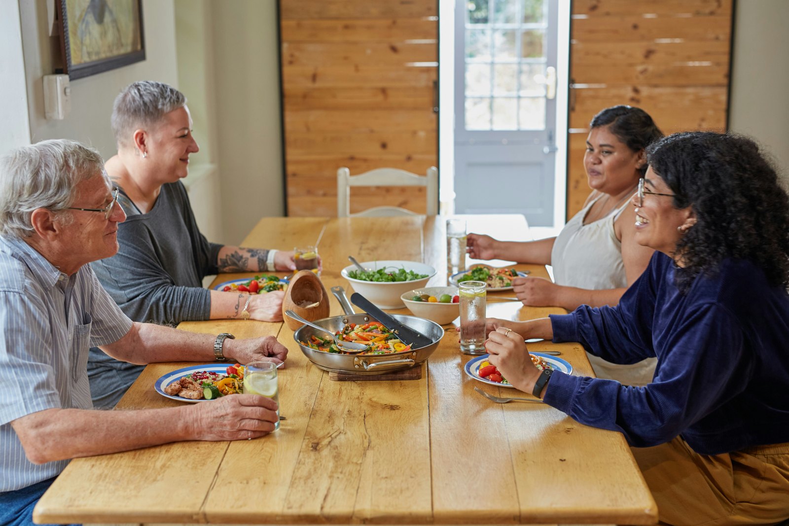 Diners enjoying a shared meal together